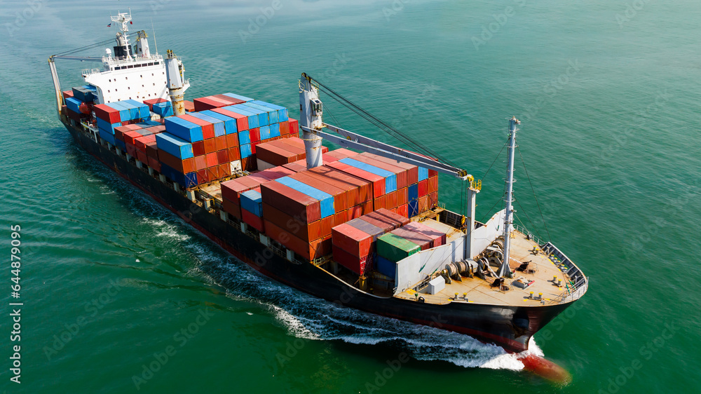 cargo logistic container ship sailing full speed in green sea to import export goods and distributing products to dealer and consumers worldwide, by container ship Transport, aerial view
