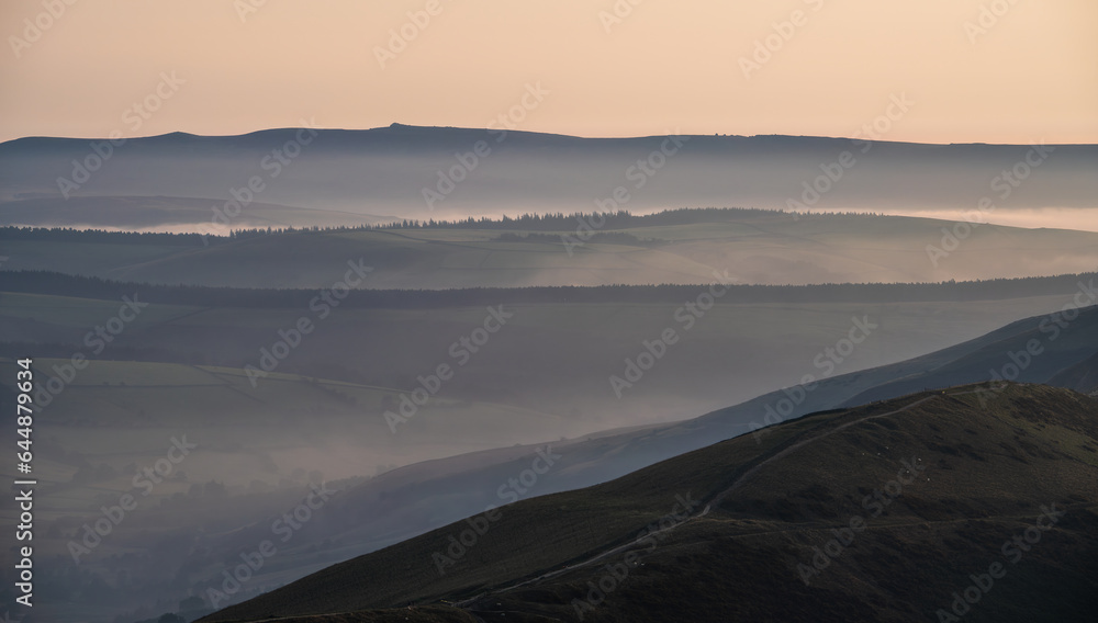 Layers of hills at Peak District - dawn morning fog Layers of hills at Peak District - dawn morning fog