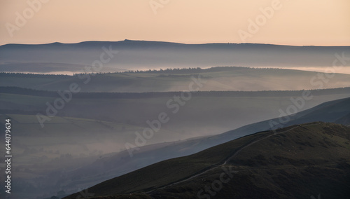 Layers of hills at Peak District - dawn morning fog