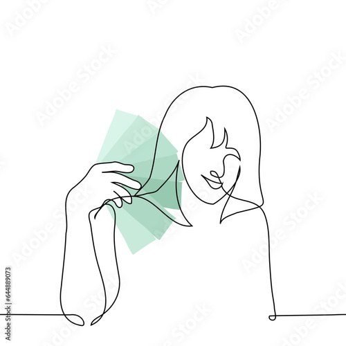 woman smiling fanning stack of green banknotes - one line art vector. concept contentment with cash in hand, winnings, savings, salary, cashback