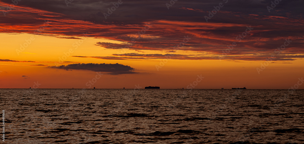 Ships on the horizon at sunset, Jantar, northern Poland