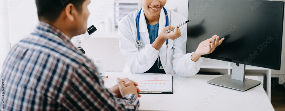 Doctor consulting with patient discussing something and Presenting results on report, Medicine and health care concept. Doctor consulting with patient discussing something and Presenting results on report, Medicine and health care concept.