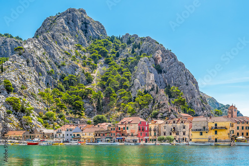 Scenic view of the old city of Omis in Croatia with the Adriatic sea and mountains with pine trees in the background