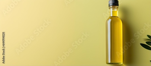 Olive oil bottle alone on a isolated pastel background Copy space