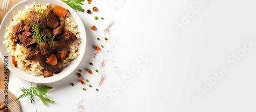 Black rice pilaf topped with braised beef isolated pastel background Copy space