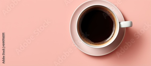 Black coffee cup placed alone on isolated pastel background Copy space