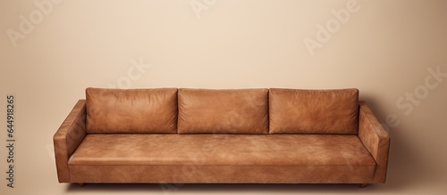 Contemporary brown suede sofa against isolated pastel background Copy space