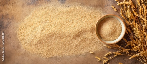 Selective focus on psyllium husk or isabgol a fiber from Plantago ovata seeds typically drunk with water to treat constipation isolated pastel background Copy space