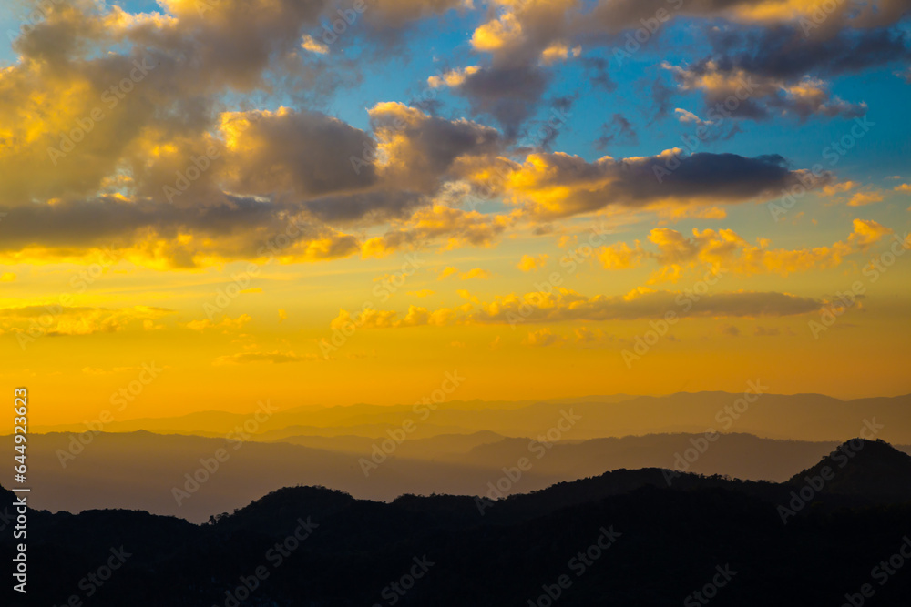 Fototapeta premium Peak of tropical forest mountain sunset sky with cloud nature landscape background