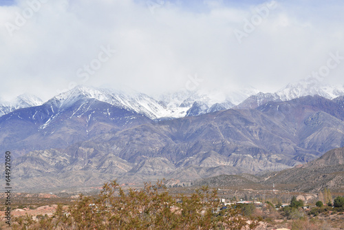 the andes mountain range in mendoza argentina with imposing mountains and snow-capped peaks. © Santiago