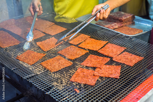 Bbq slice meat pork in the street food Jalan Alor in Kuala Lumpur photo