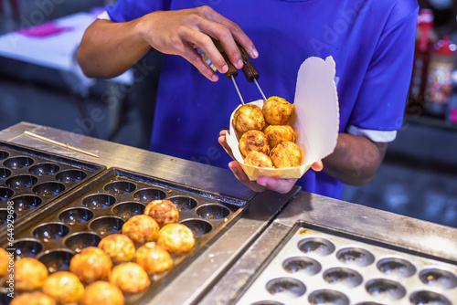 Photography Takoyaki balls in Jalan Alor street food in Kuala Lumpur