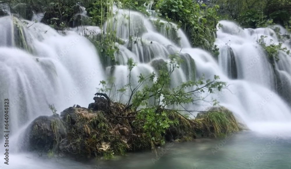 Fototapeta premium Waterfall in the forest near Plitvička Jezera, Croatia, May 2019