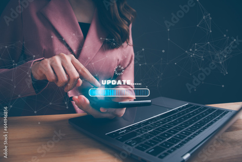 Obraz na płótnie Woman using smartphone update program software. Program upgrade business technology internet on virtual screen. loading bar with installing the update for quality better. Internet technology concept