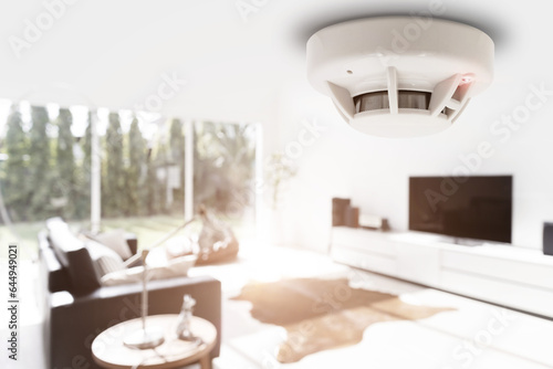 smoke detector fire alarm detector home safety device setup at home apartment room ceiling photo