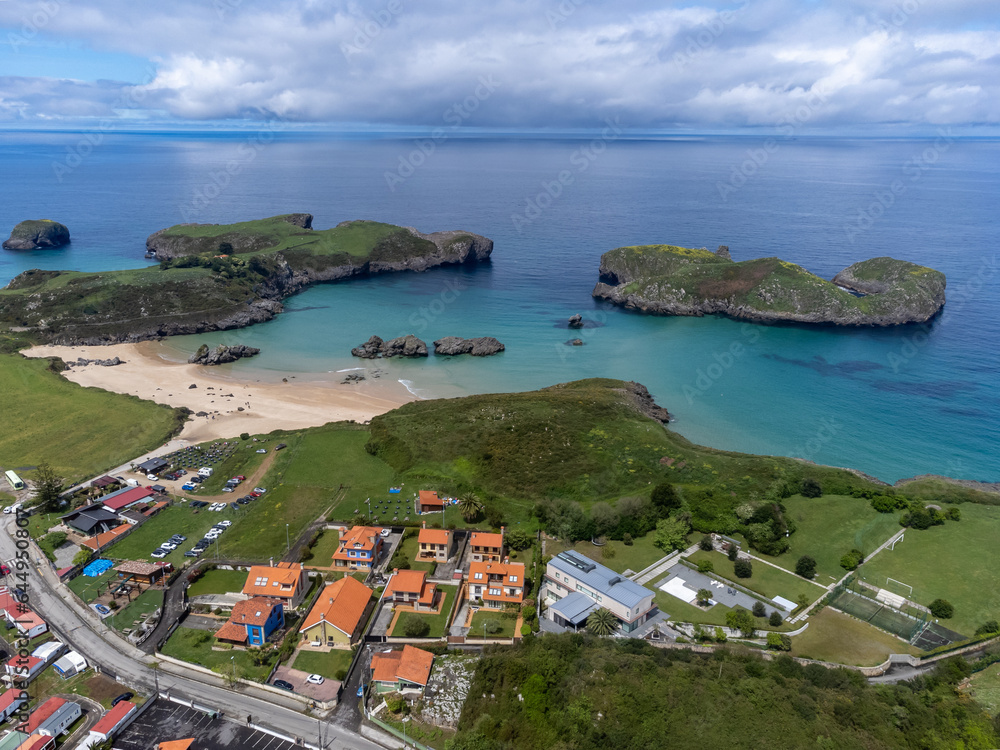 Aerial view on Playa de Borizo and Celorio, Green coast of Asturias, North Spain with sandy beaches, cliffs, hidden caves, green fields and mountains.