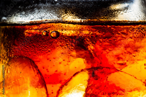 Cola and Ice, food background, Cola close-up, design element. Beer. Macro bubbles, ice, bubbles, background, ice cubes, abstract background.