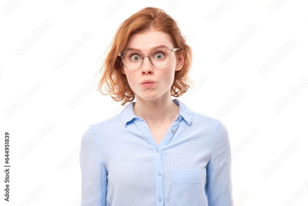 Portrait of surprised young woman with bulging eyes shocked by news, shyly looking at camera isolated over white studio background. Portrait of surprised young woman with bulging eyes shocked by news, shyly looking at camera isolated over white studio background.