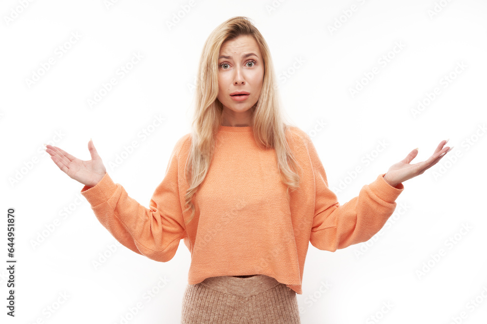 Portrait of shocked young woman with open mouth and raised hands isolated on white studio background. Concept unexpected news Portrait of shocked young woman with open mouth and raised hands isolated on white studio background. Concept unexpected news