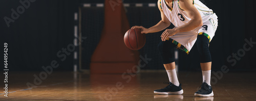 Basketball Player Dribbling A Ball. Basketball , Sport, Dribbling Basketball Player. Unrecognizable Basketball Player Dribbling © matimix