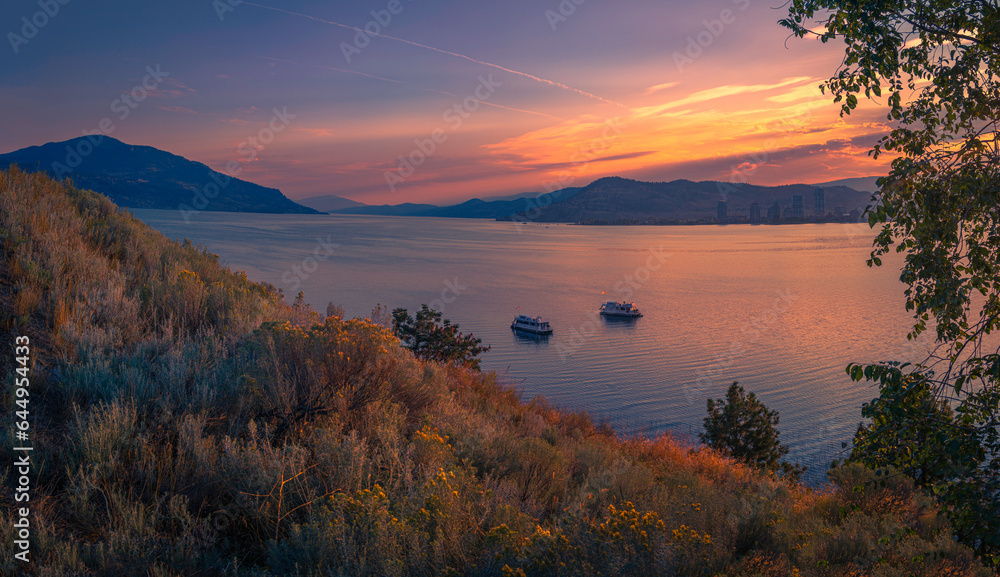 Kelowna skyline at sunset over Okanagan Lake in British Columbia, western Canada, Okanagan Valley Wine Country landscape