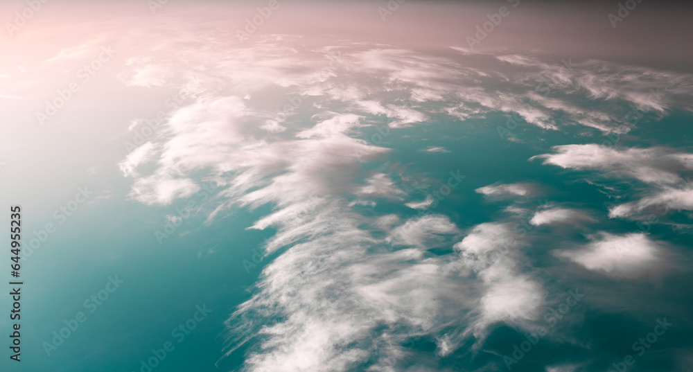 Naklejka premium Beautiful and colourful landscape of sunset or sunrise with white clouds, blue green sky with pastel pink color. Natural abstract background. Panoramic banner view.