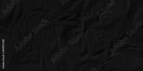 Dark crumple black paper wrinkled poster template ,blank glued creased paper texture background. black paper crumled backdrop background. used for cardboard and clarkboard.