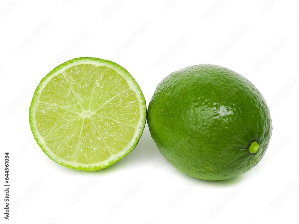 Fresh green lemons and lime leaves placed on a white background. Fresh green lemons and lime leaves placed on a white background.