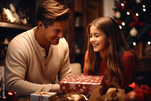 Lovely family opening their gifts. They enjoy the warm Christmas atmosphere. AI Generated