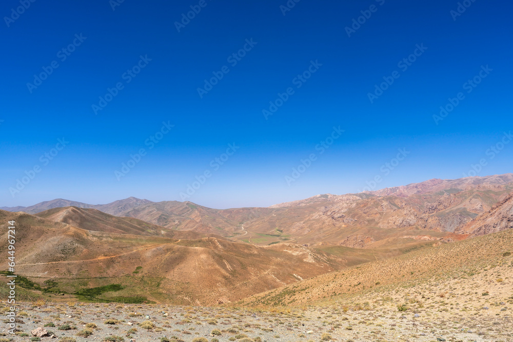 Hindu Kush in Central Afghanistan, an arid landscape where semi nomadic tribes herd cattle and grow crops in marginal and harsh environment. Hindu Kush in Central Afghanistan, an arid landscape where semi nomadic tribes herd cattle and grow crops in marginal and harsh environment.
