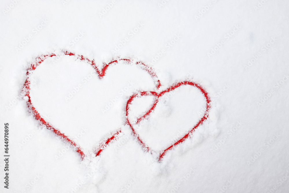 Red hearts on the snow. Snowy day in a city. Love concept. Winter mood. Valentine’s Day Red hearts on the snow. Snowy day in a city. Love concept. Winter mood. Valentine’s Day