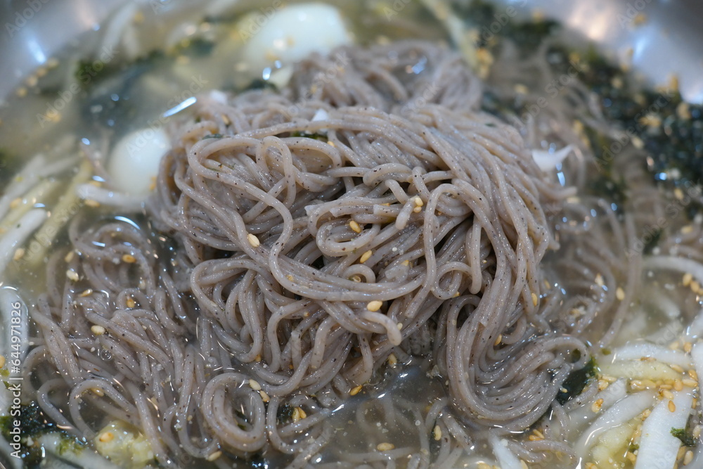 Cold Buckwheat Noodles are a food in Korean cuisine where noodles made from wheat or buckwheat are eaten wrapped in cold broth or mixed with seasoning.