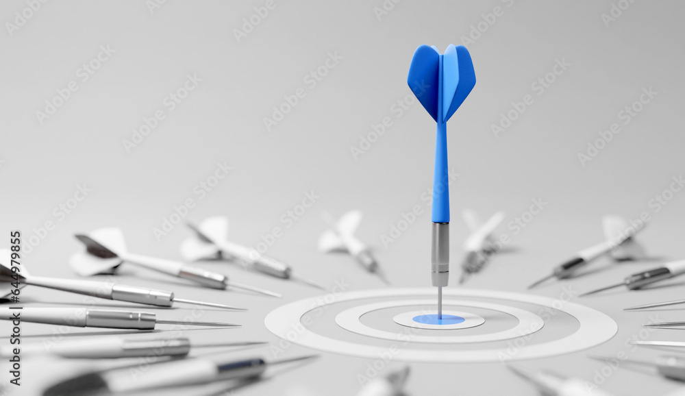 Dart arrow on center of dartboard, metaphor to target success, winner concept,competitive advantage, strategic marketing concept Dart arrow on center of dartboard, metaphor to target success, winner concept,competitive advantage, strategic marketing concept