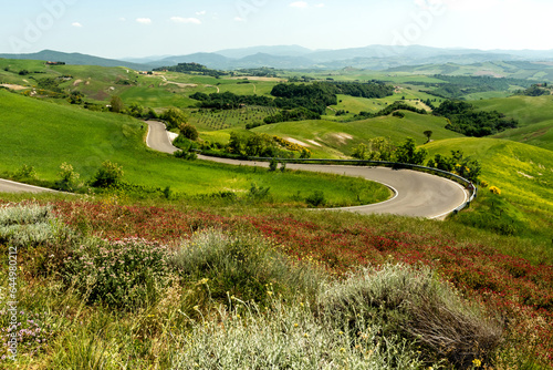 View of valley with hills and road, Tuscany. Italy