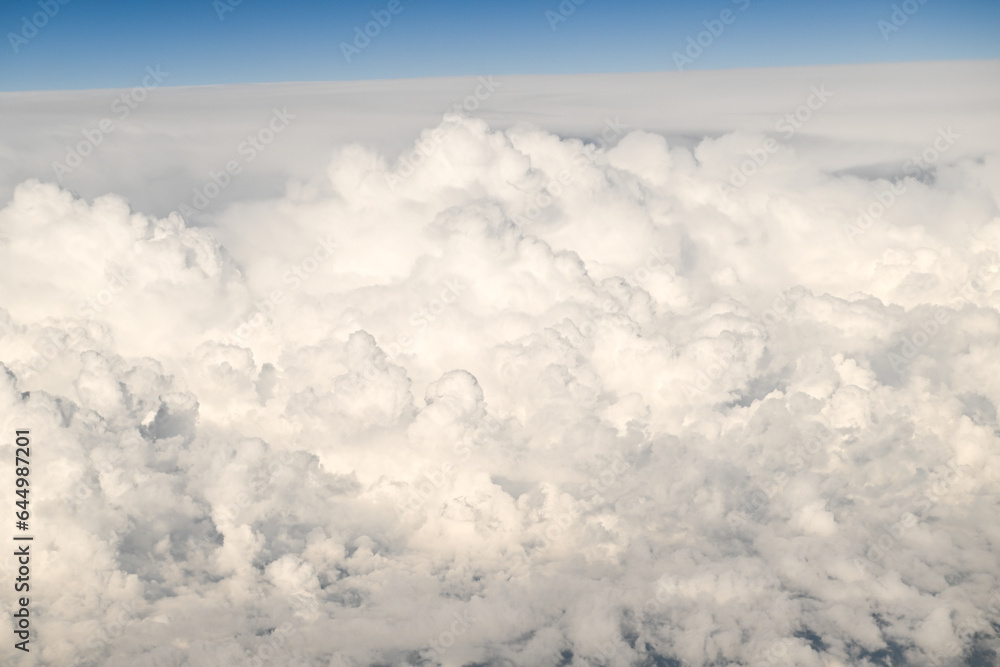 Beautiful Fluffy White and Gray Cumulonimbus Clouds on Blue Sky Beautiful Fluffy White and Gray Cumulonimbus Clouds on Blue Sky