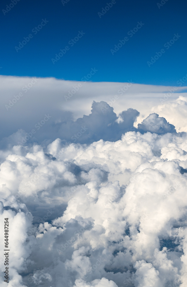 Beautiful Fluffy White and Gray Cumulonimbus Clouds on Blue Sky Beautiful Fluffy White and Gray Cumulonimbus Clouds on Blue Sky