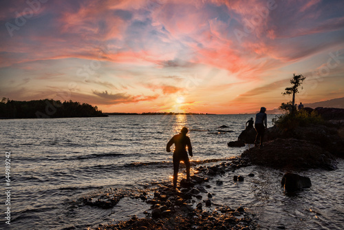 Walking on Rocks through Water. Stepping stones to an island to watch the sunset. © David Arment