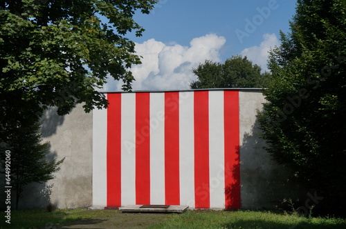 White and red stripes on wall. World War II memorial. Sosnowiec, Poland. photo