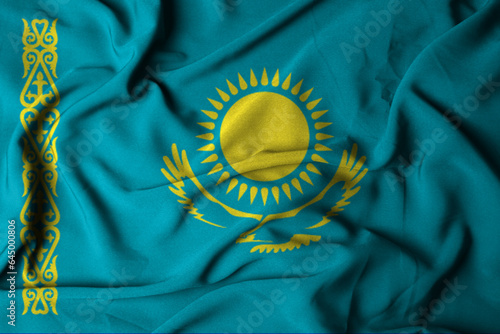 selective focus of kazakhstan flag, with waving fabric texture. 3d illustration photo
