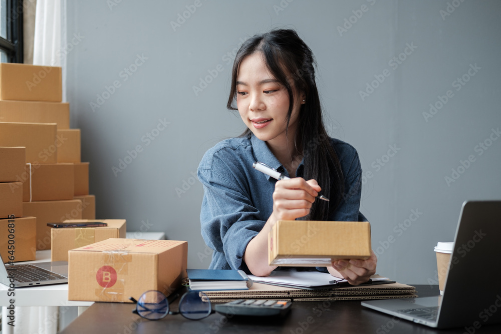 Asian small business owner working at home office. Business retail market and online sell marketing delivery, SME e-commerce concept. Asian small business owner working at home office. Business retail market and online sell marketing delivery, SME e-commerce concept.