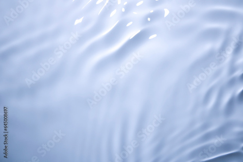 The surface of the water is clear  blue  soft and shiny.