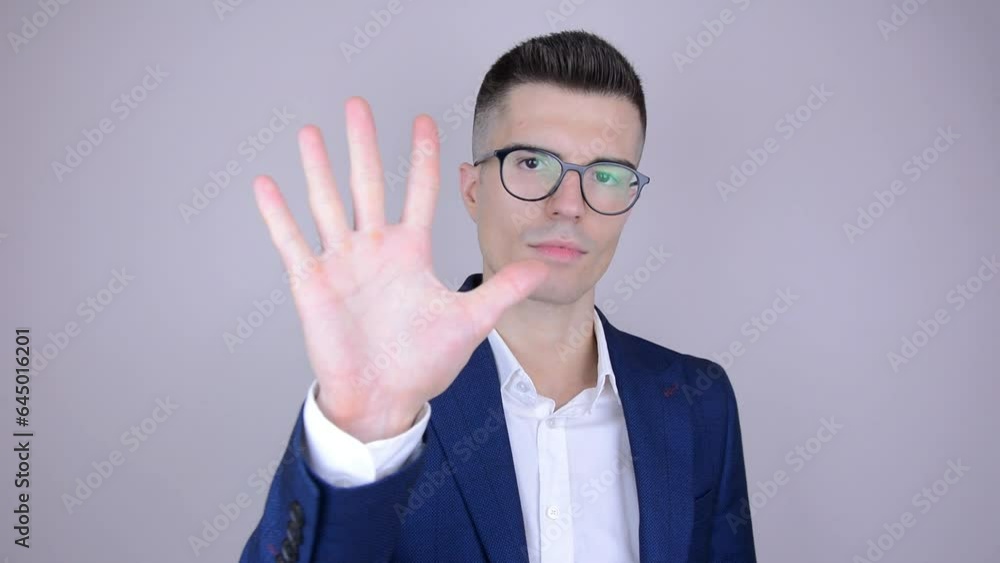 Man counts to five on fingers. Counting to 5, young businessman on isolated background. Man counts to five on fingers. Counting to 5, young businessman on isolated background.