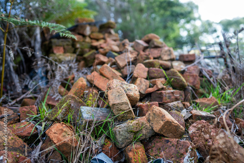 Fotografi very old pile of red convict bricks for construction in tasmania australia