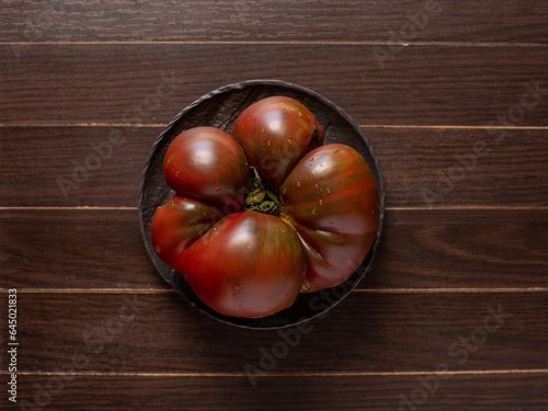 Ripe and large brown tomato, rich harvest