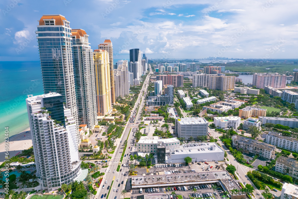 Sunny Isles Beach Florida. Panorama of Miami Beach FL. Atlantic Ocean beach. Beautiful seascape. Turquoise color of sea water. Summer vacation in Florida. Aerial view on Hotels and Resorts on Island