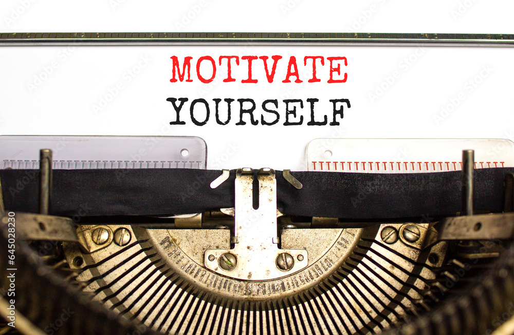 Motivate yourself symbol. Concept words Motivate yourself typed on beautiful old retro typewriter. Beautiful white paper background. Business psychology motivate yourself concept. Copy space.