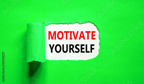 Motivate yourself symbol. Concept words Motivate yourself on beautiful white paper. Beautiful green paper background. Business psychology motivate yourself concept. Copy space.