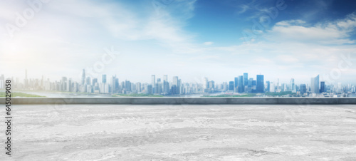 Empty cement floors city  skyline and modern business office buildings with blue cloud sky