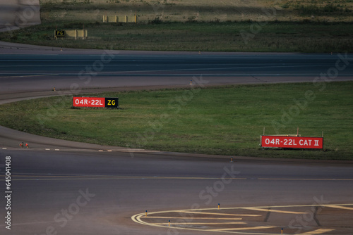 Airport apron, runway and taxiway. Airport tarmac signs.