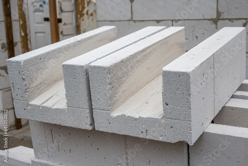 U Blocks of aerated concrete close-up, blocks for pouring concrete. Laying aerated concrete blocks. Construction of aerated concrete blocks, bricks. photo